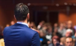 Man presenting in front of group